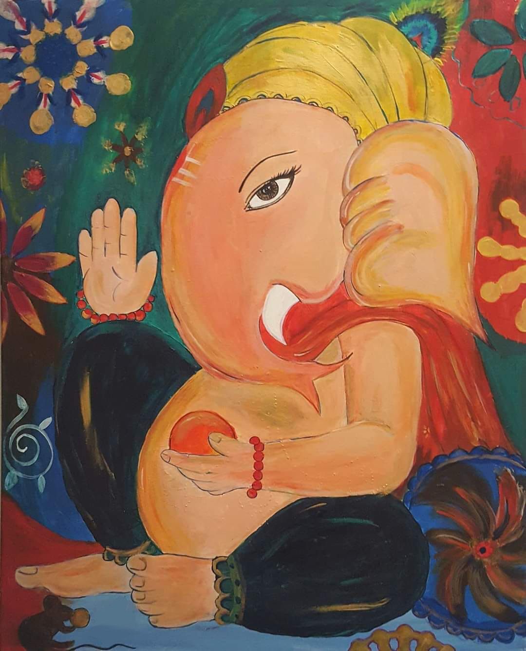 A colourful painting of Lord Ganesha raising his hand in blessing