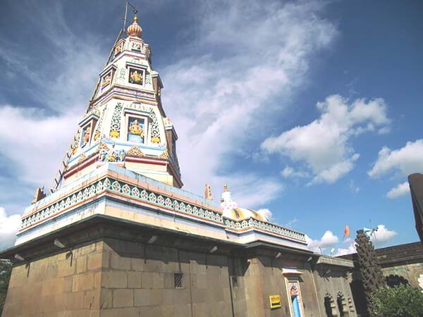 The white tower of the Vighnahar Ganapati temple at Ozar, India